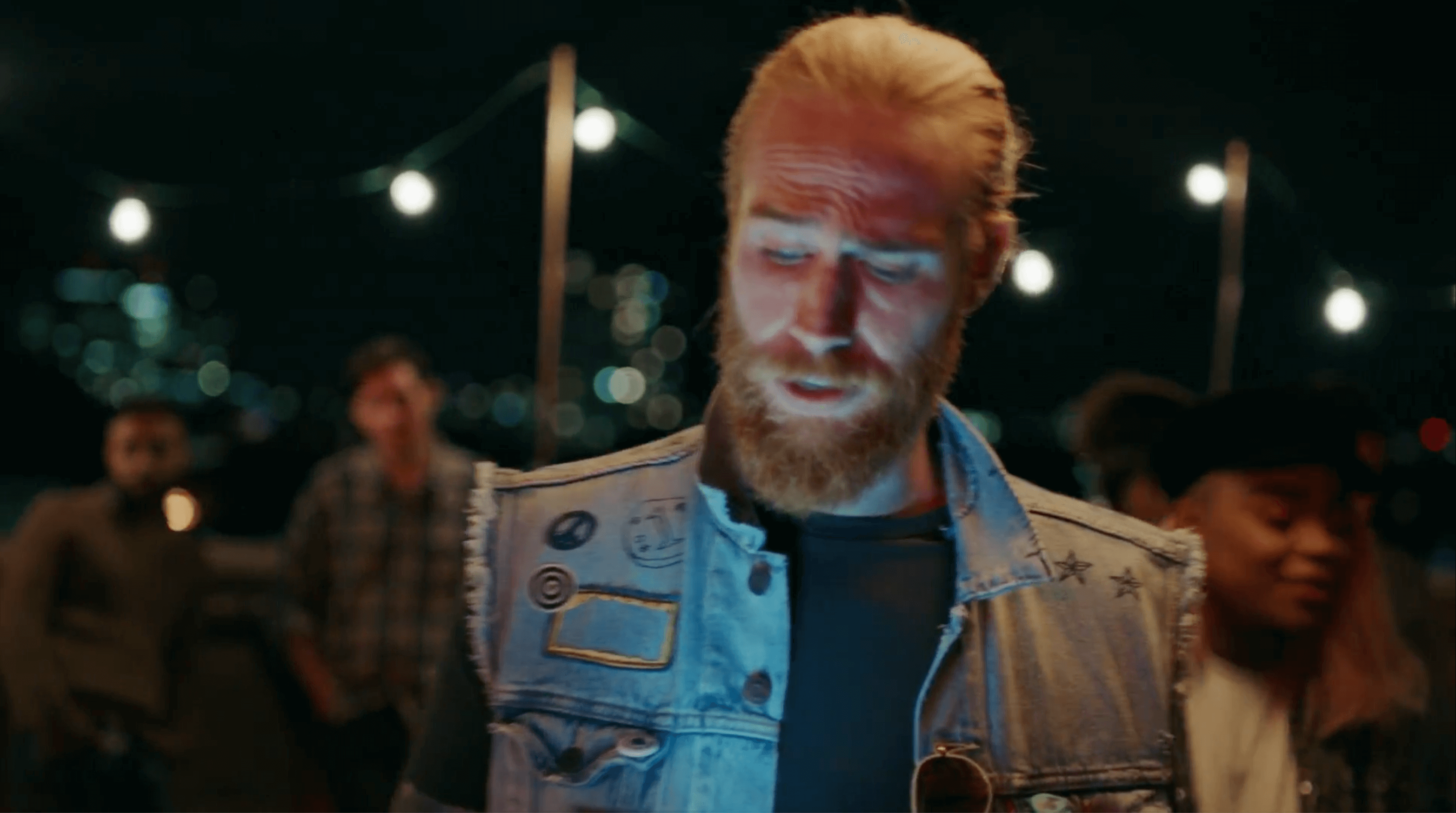 man with beard wearing jean jacket